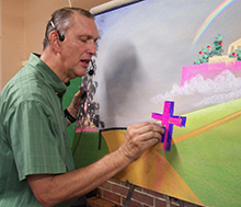 A photo of Paul Young, οƵ alumnus, drawing.
